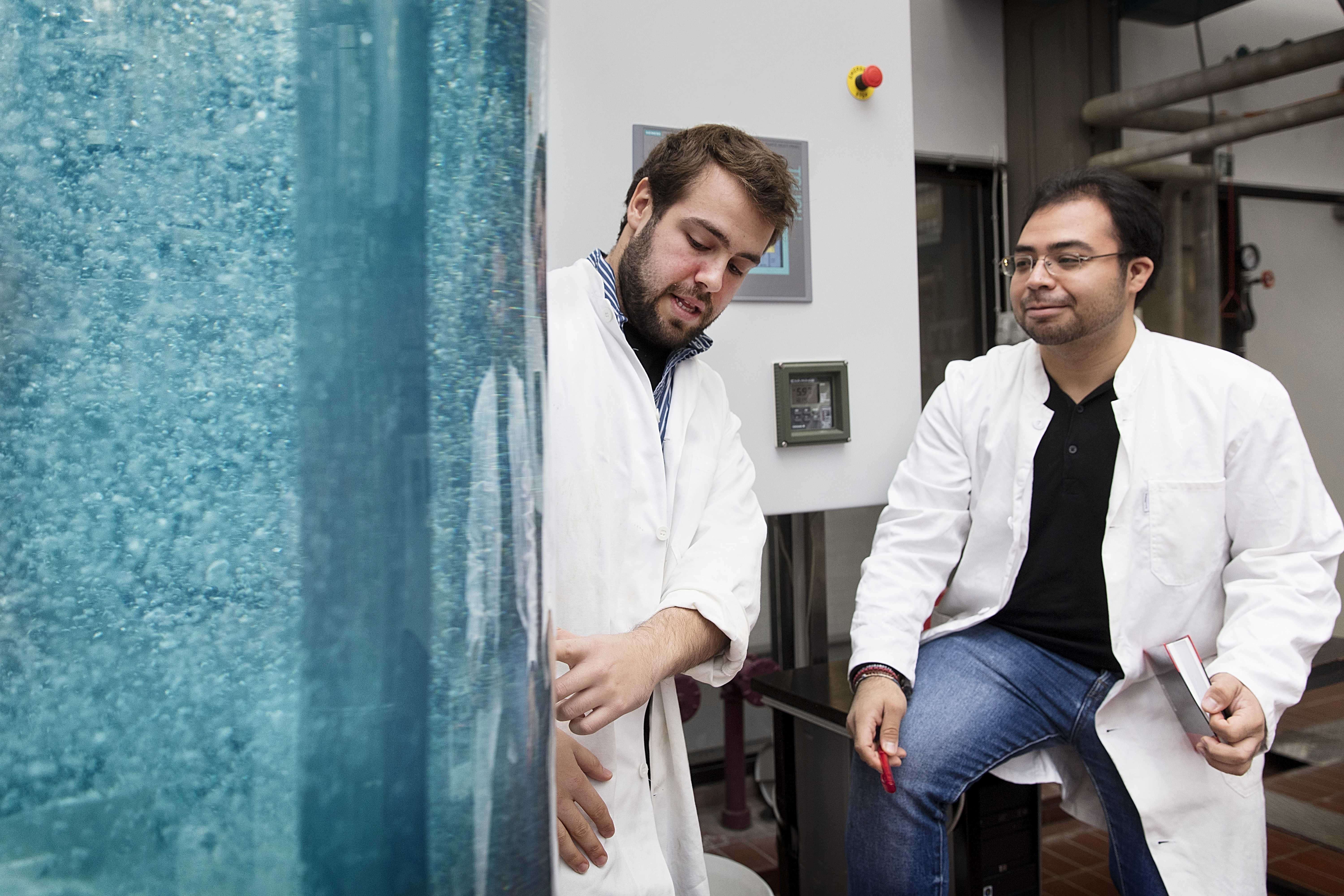 PhD-students Frederico Montes and Carlos Eduardo Castelan behind a stirred tank which they are using for process intensification of gas-liquid bioreactors - a core research area at the PROSYS Research Centre. Photo by Thorkild Christensen.
