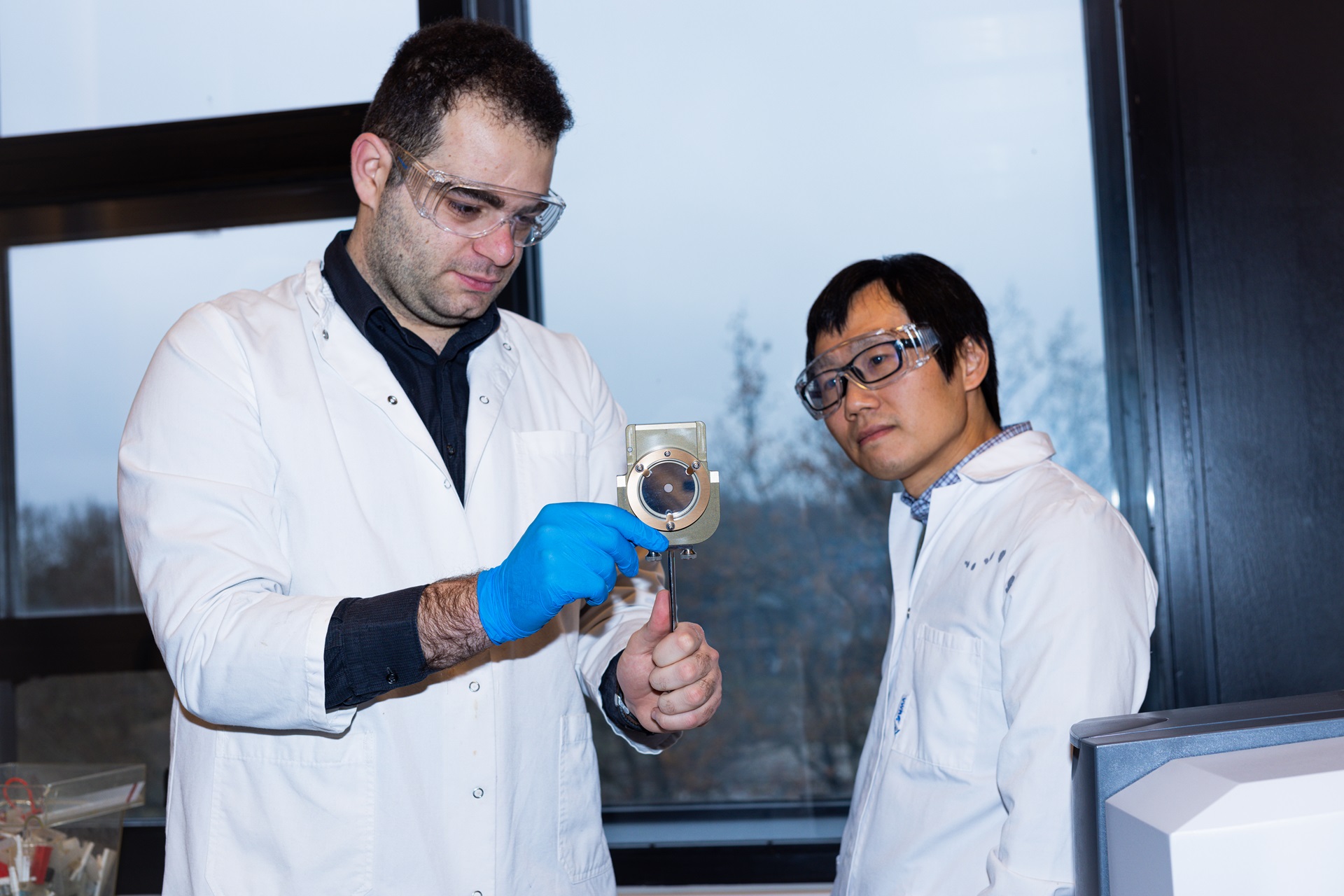 PhD student Evangelos Drogkas and Assoc. Professor Xiaodong Liang replaces the KBr beamsplitter for configuring the instrument for NIR transmission measurements
