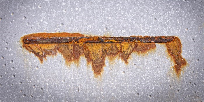 Corrosion developed after a deliberate damage of the coating and after exposure to salt spray